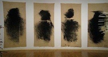 Abstract black figures on canvas