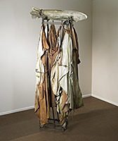 Sculptural piece with draped cloth and rod